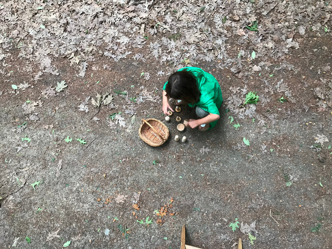 A child plays alone in the forest